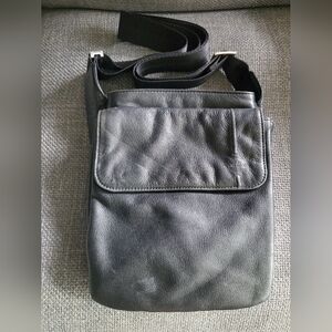 Small black Tumi pocket bag